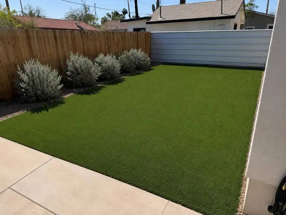 Clean, vibrant artificial turf in a backyard after Turfflex service