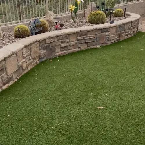 Turfflex technician cleaning artificial grass