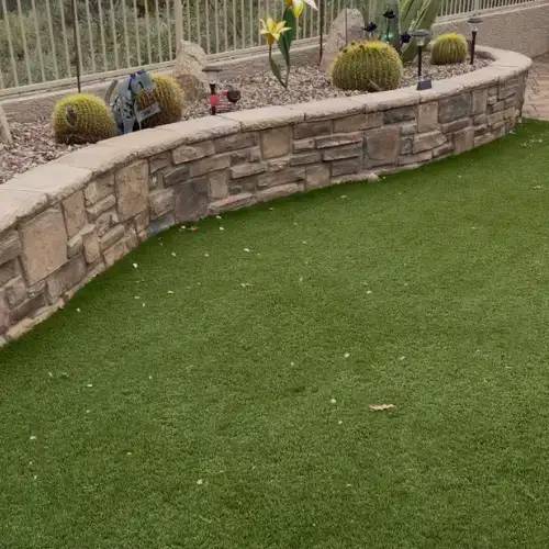 Turfflex technician cleaning artificial grass